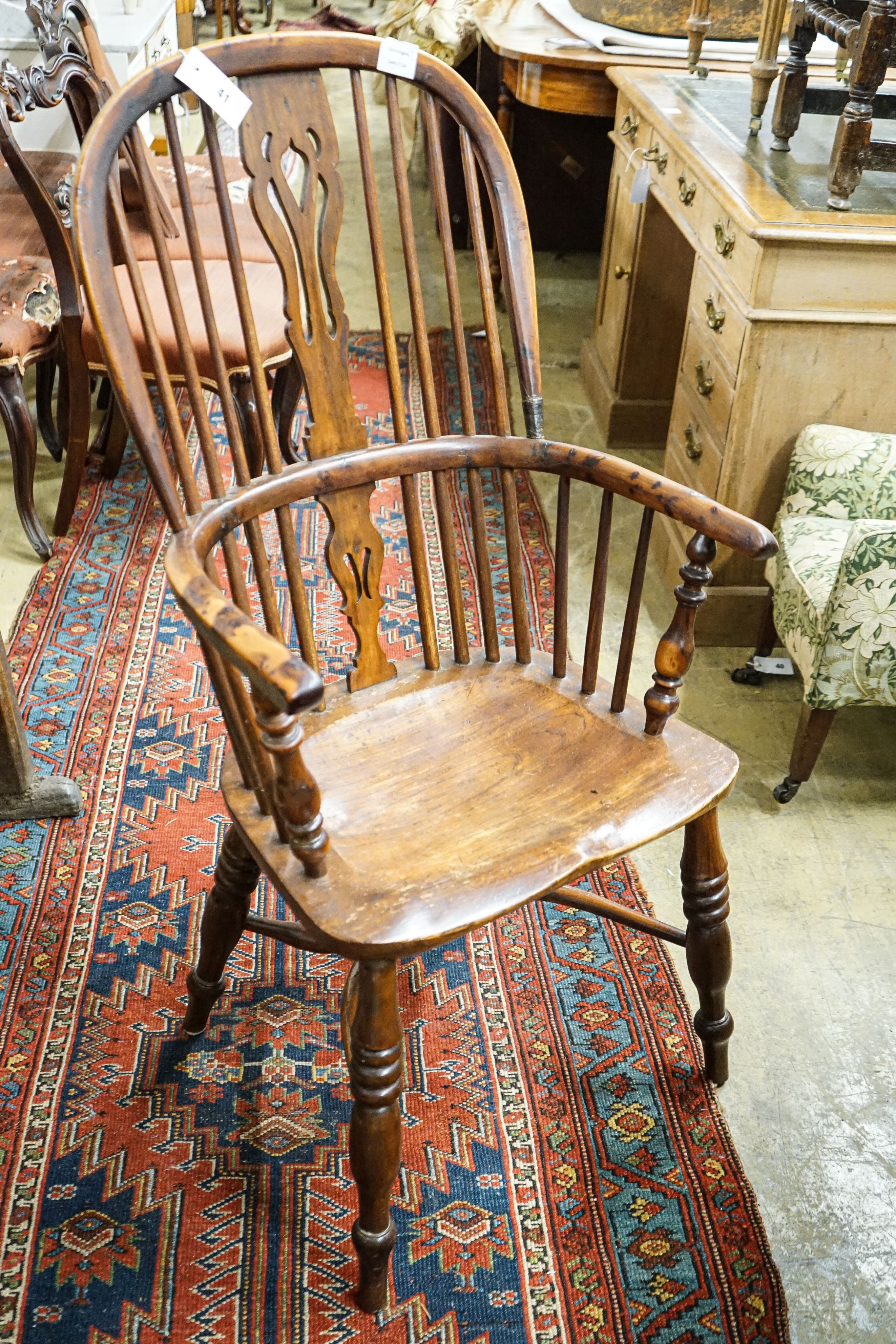 A harlequin set of four Victorian Windsor chairs, comprising near pair of yew, beech and elm, with crinoline stretchers and two others in oak, elm and ash with H stretchers